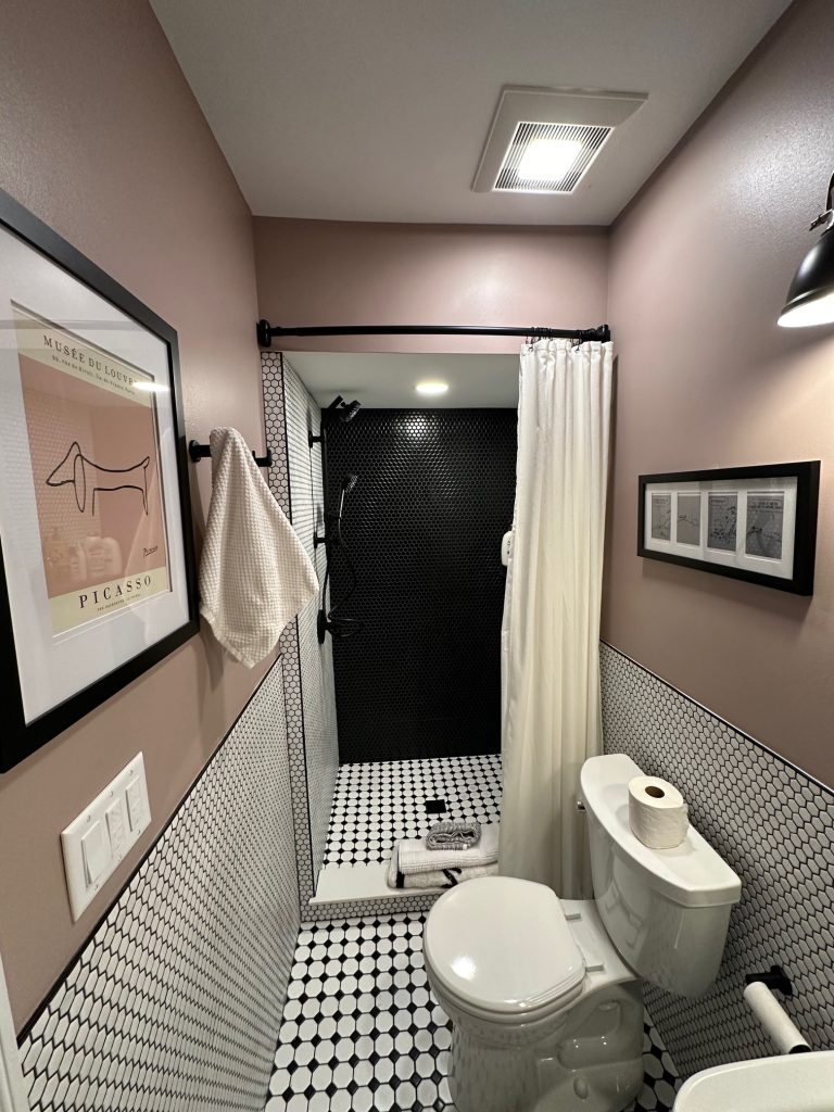 Cedar Rapids Bathroom Remodeler displaying Renovated Bathroom in Cedar rapids including bathroom floor tiling and walk in shower installation